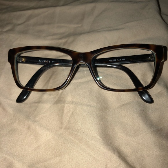 Gucci Accessories - Gucci tortious with green inner accent
